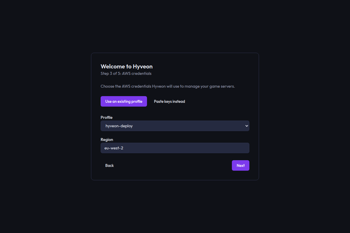 The credentials step with the Use an existing profile mode selected, a profile dropdown and a region field